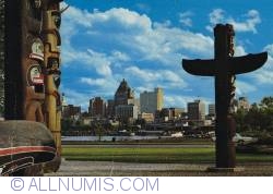 Image #1 of Vancouver - Totem poles and City Skyline