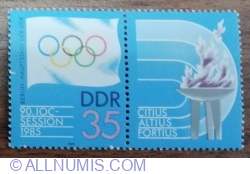 Image #1 of 35 Pfennig 1985 - Sesiunea Comitetului Olimpic Internațional (COI), Berlin - Steag olimpic / ZF cu flăcări olimpice
