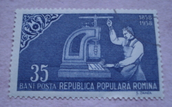 35 Bani 1958 - Printer at a manual stamp printing press